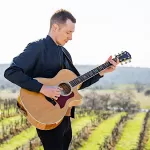 Dylan Vroom strums into Willamette Wineworks Saturday