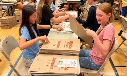 Hundreds prep food drive bags for Community Service Day